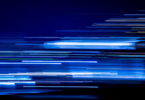 Abstract image showing blue light smeared on black background