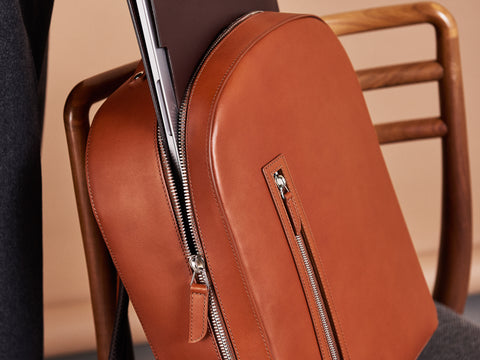 Removing a laptop from Carl Friedrik cognac backpack