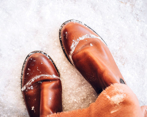 Brown leather boots in the snow