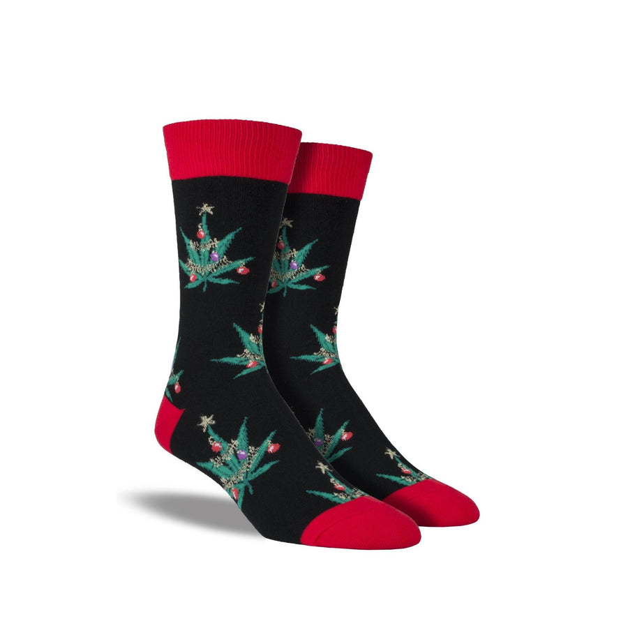 Black socks with red accents and holiday decorated pot leaves on them