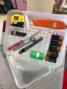 Poke-a-dot Organizer shown in clear filled with tiny objects