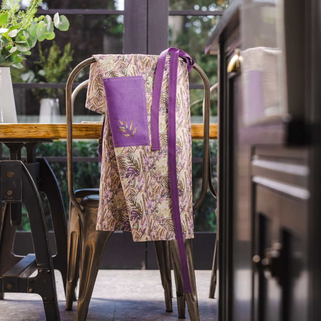 Ulster Weavers Mourne Heather Recycled Cotton Apron in purple floral design for country style kitchen