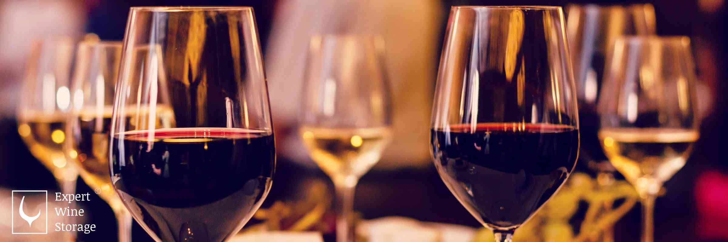 Red and White Wine Glasses on a Table