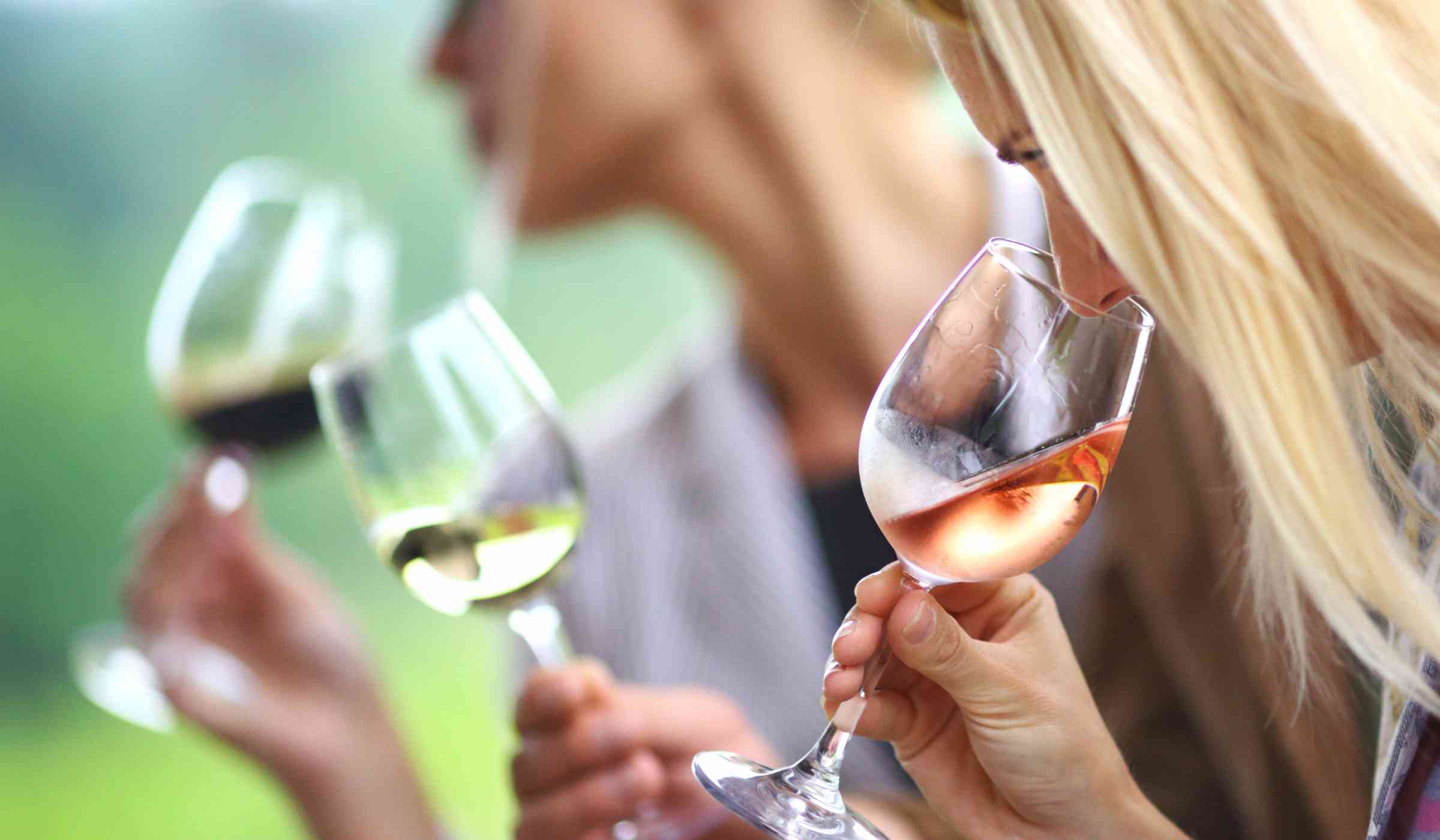 Woman tasting wine