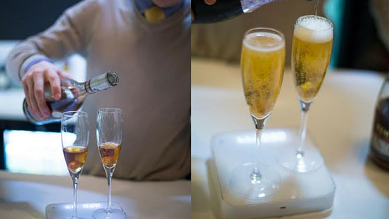 champagne being poured on scale in bar