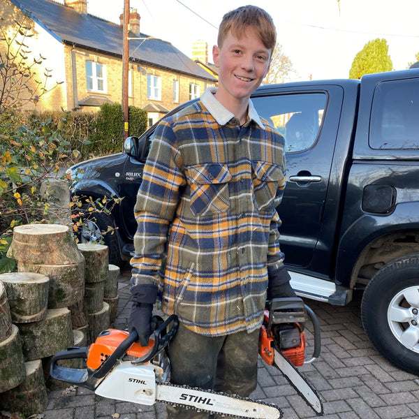 Ben Cornish Prepping Wood Using Chain Saw