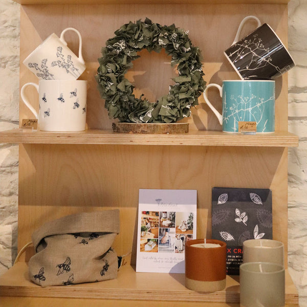 Helen Round Shop Shelves Decorated With Fabric Rag Wreath