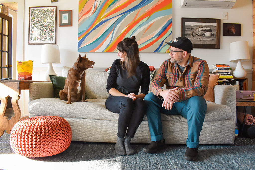 Brainstorm Briana and Jason with dog Maple on couch