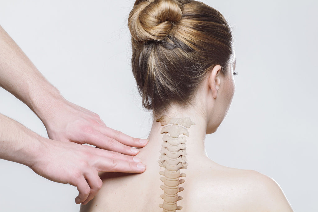 Woman with spinal column drawing on back
