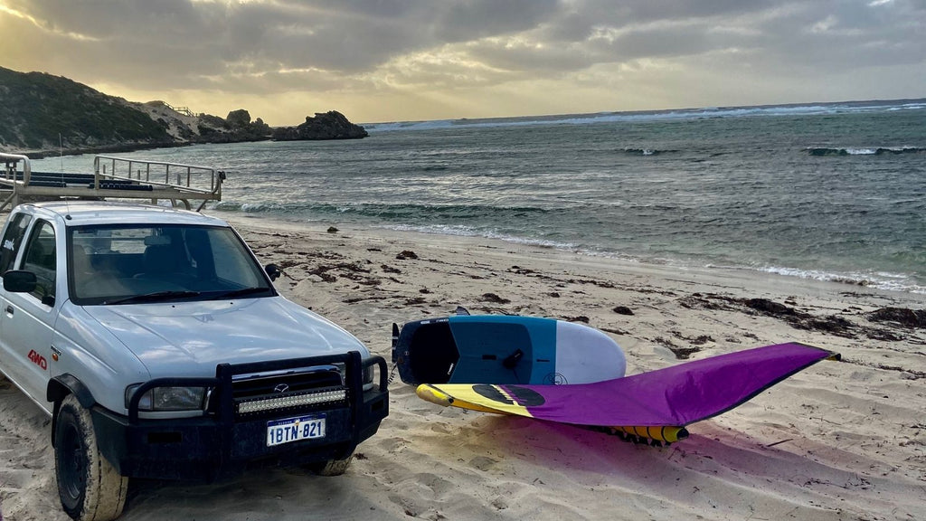 Smik wing on beach by ute 