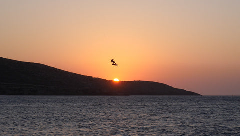 Kitesurfer kiting in sunset