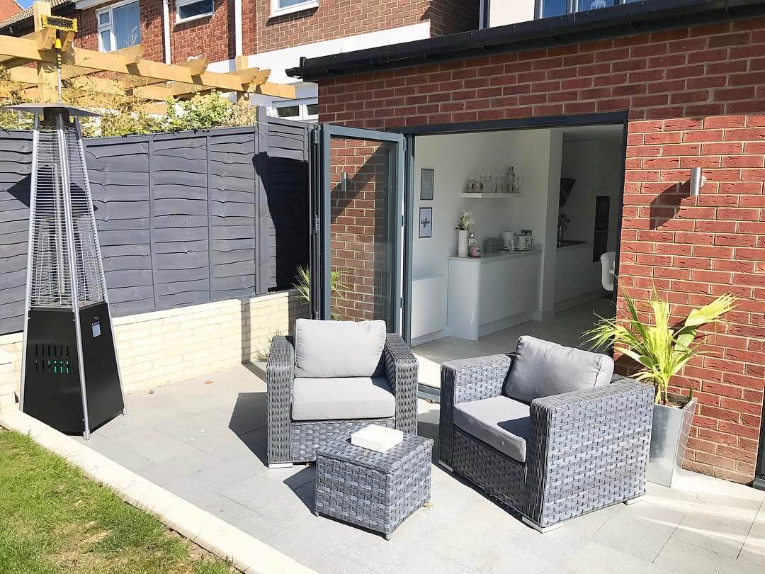 Fancy hanging out in this contemporary modern garden with bifolding doors that lead on to a scandinavian inspired kitchen?