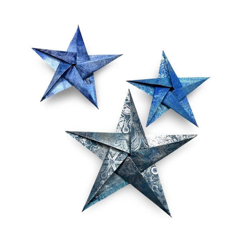 3 origami stars folded out of blue gel printed washi paper