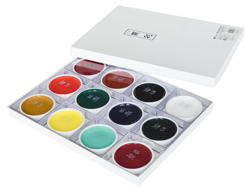 12 round gansai colors packaged in a box with the lid off to the side