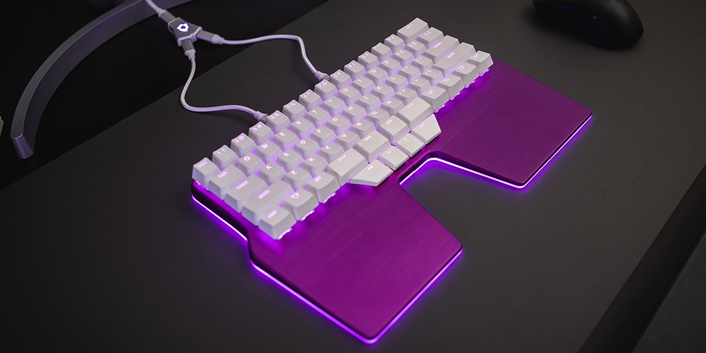 The Dygma Raise is purple with white keycaps