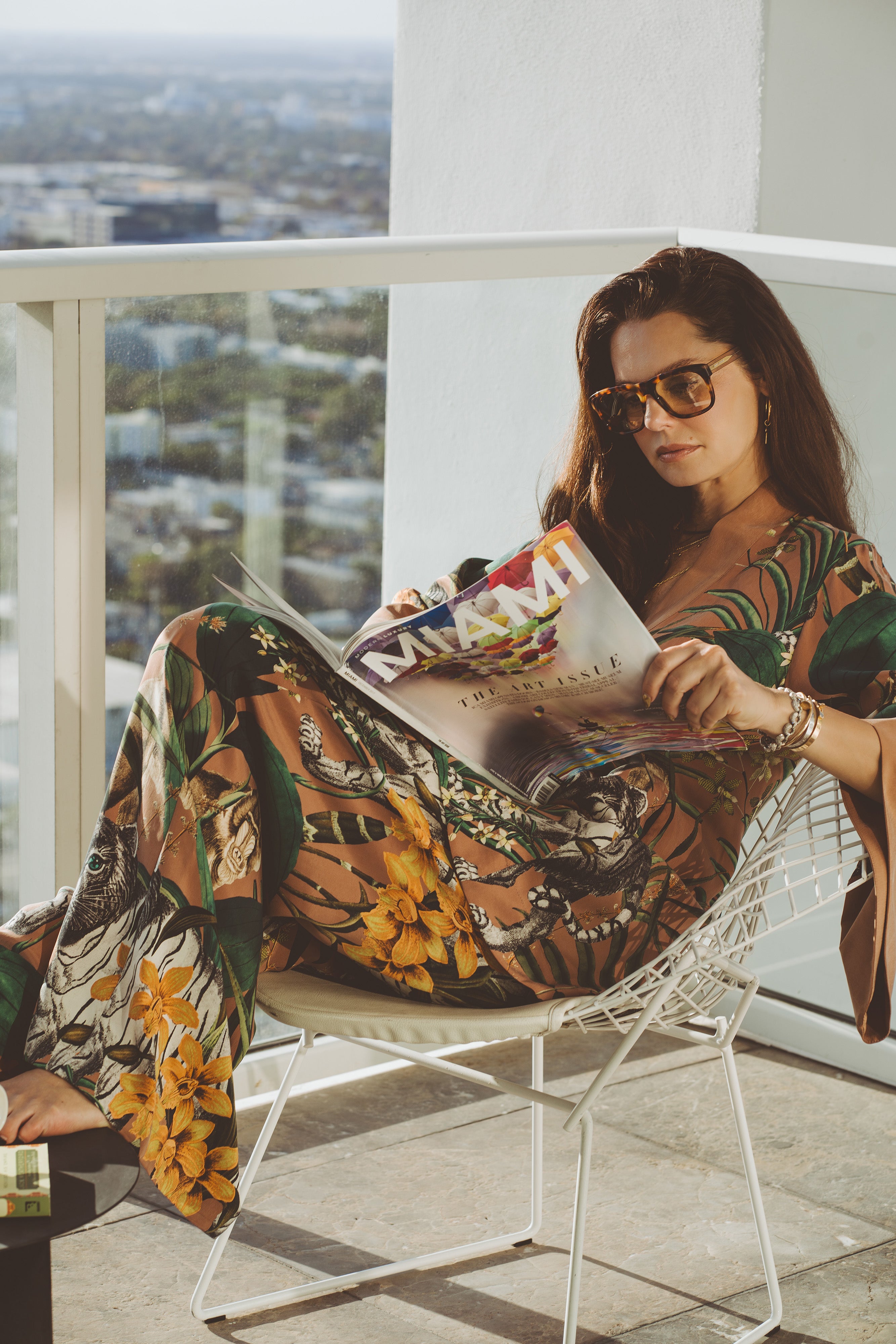 Madlena Kalinova reading a magazine