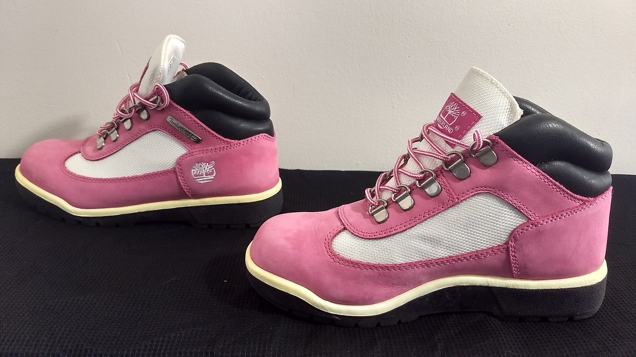 white and pink timberland boots
