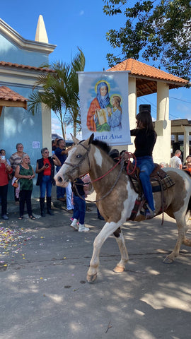 Horses arrive to start the traditional Catholic mass at the light blue chapel