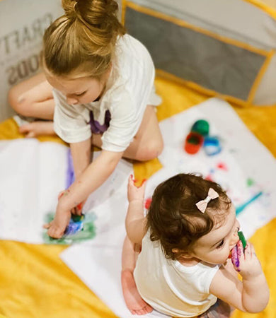 Children painting together in a Crafty Pod