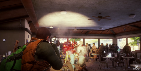 Personaje soplando la cabeza de un zombi Undead Labs / Xbox