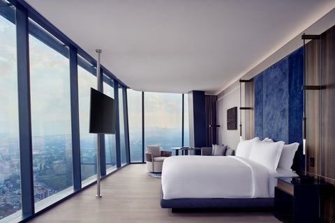 Hotel room with wall to ceiling windows