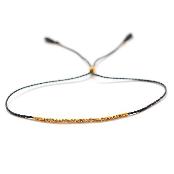 Delicate Gold on black silk bracelet