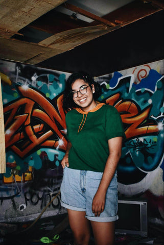 woman wearing longer jean shorts