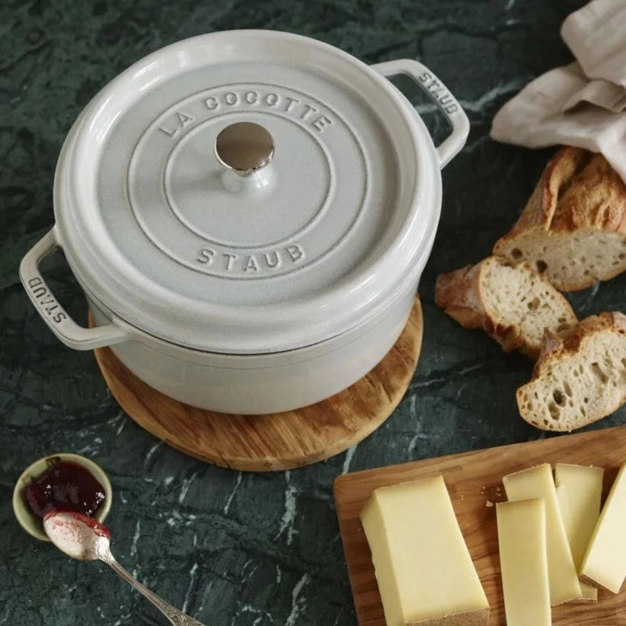 Sold at Auction: Staub Cast Iron 5 qt. Pumpkin Cocotte Dutch Oven with Four  Matching Petite 16 oz. Cocottes- All in Burnt Orange