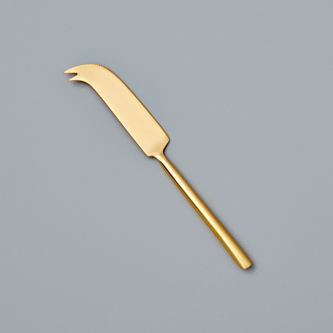 https://cdn.shopify.com/s/files/1/0376/0920/9900/products/Be-Home_Matte-Gold-Cheese-Knife-_25-1031.jpg?v=1611260127&width=1100