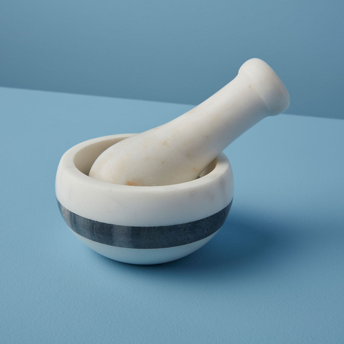 https://cdn.shopify.com/s/files/1/0376/0920/9900/products/Be-Home_White-and-Gray-Marble-Mortar-and-Pestle-with-Stripe_58-40.jpg?v=1606271947&width=1100