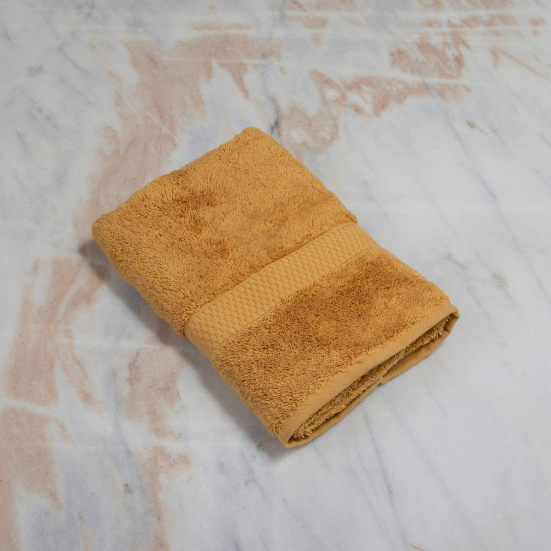 https://cdn.shopify.com/s/files/1/0376/0920/9900/products/cinnamonhandtowel.jpg?v=1670459155&width=1100