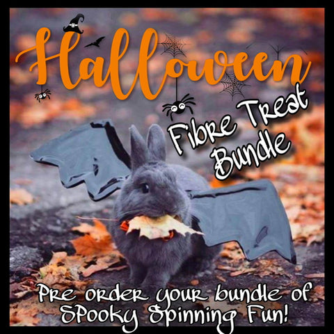 Black bunny with batt wings and biting on an autumn leaf announcing a Halloween fibre treat for pre order