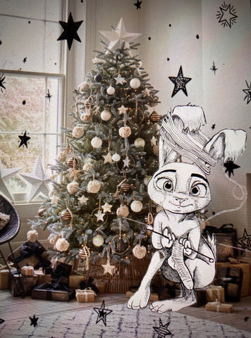 A Bunny knitting beside a Xmas tree sitting on top of a bunch of presents