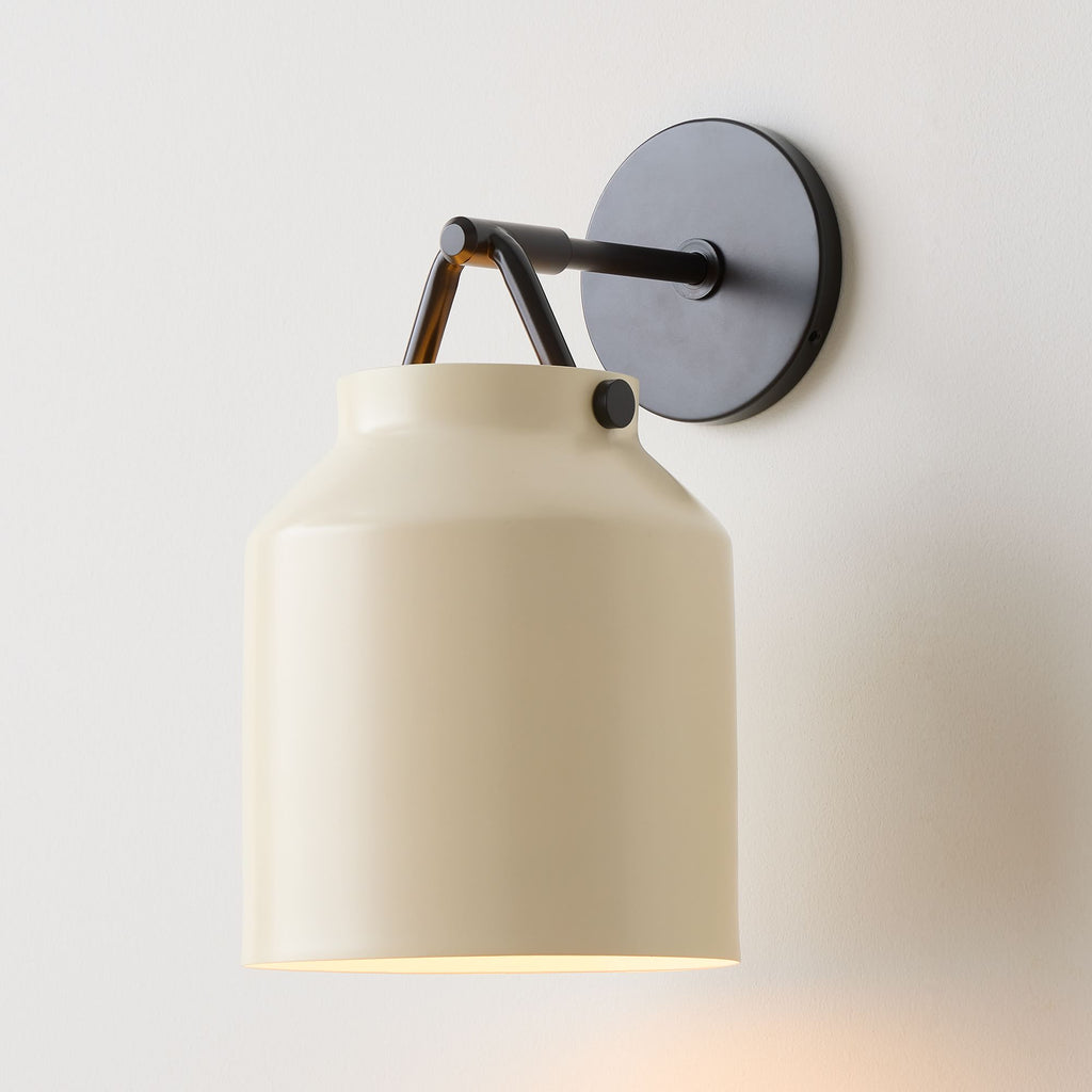 Ivory with Dark Bronze Wall Sconce, used by ULAH Interiors + Design in nursery design.