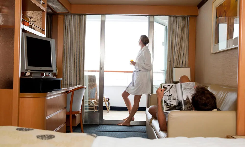 image of couple in an cabin on a cruise ship in bath robes