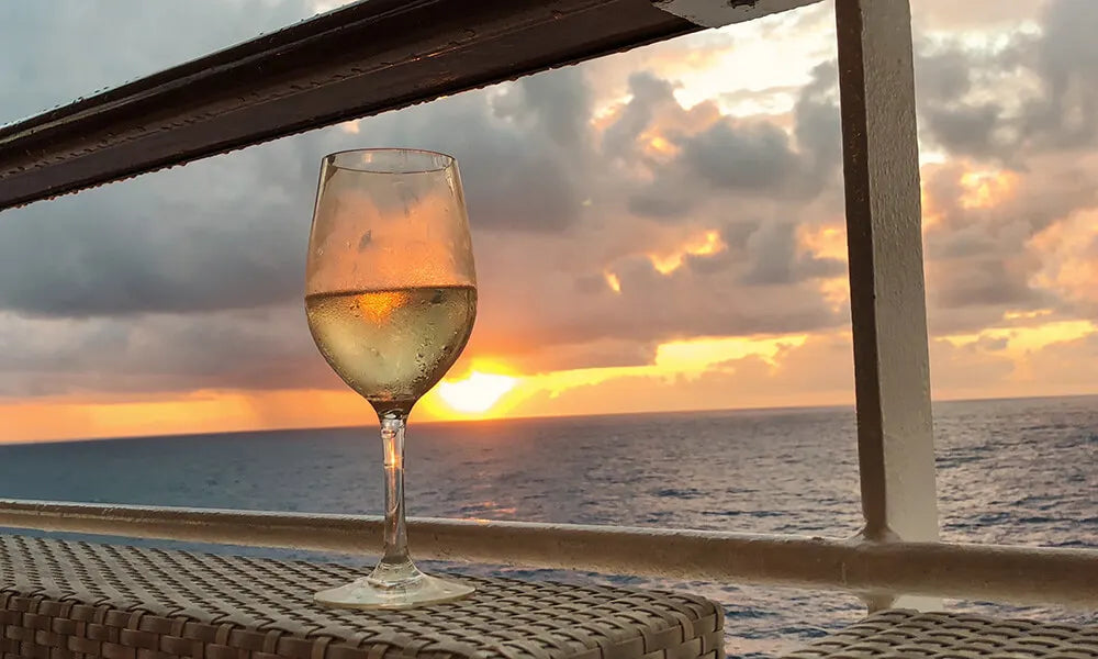 Glass of white wine on a cruise ship bar table