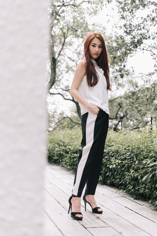 Alicia Tan in the Eloise Organza Panel Sleeveless Top in White & Charlize Contrast Panel Tapered Pants in Black with White Stripe