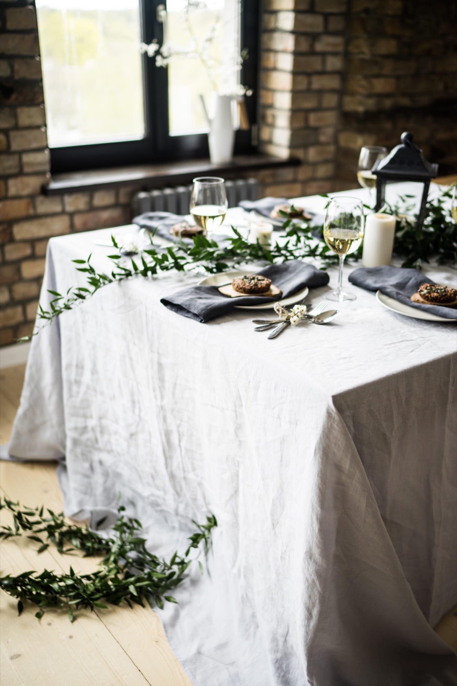 Custom tablecloth from organic linen, rectangular shape, light gray color.