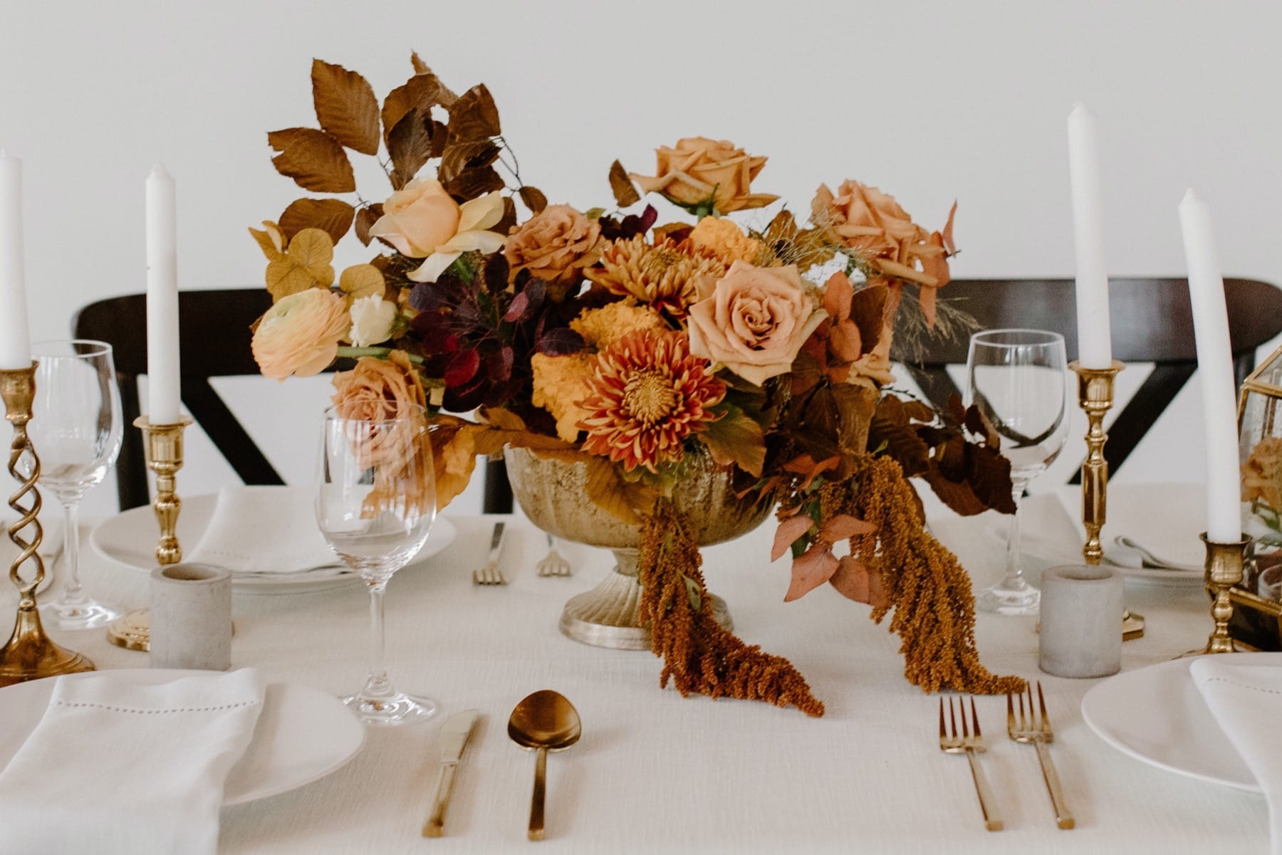 Dried flowers composition on Thanksgiving table with candles