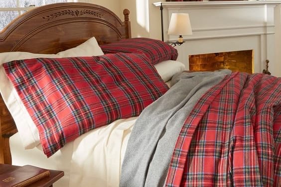 plaid flannel bedding in red color on a bed