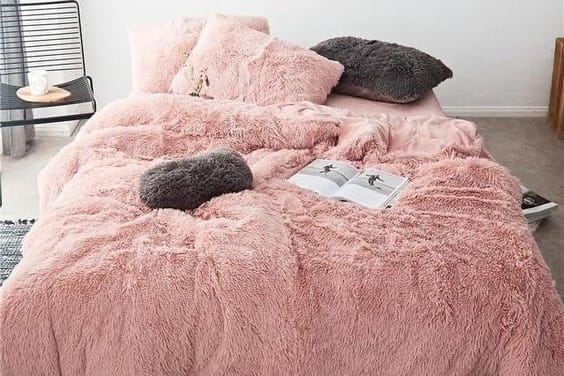 pink fleece bedding on a bed