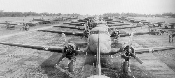 Douglas C-47s and CG-4A Waco Gliders lined up on the runway at Membury Airfield, 1944.