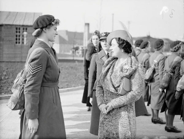 Queen Elizabeth chatting with a WAAF sergeant whilst visiting RAF Innsworth during the Second World War.