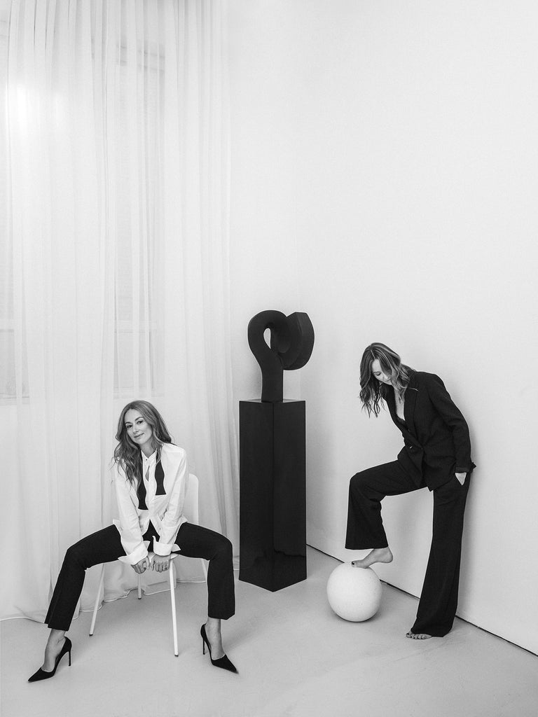 Women sitting on sculptural furniture