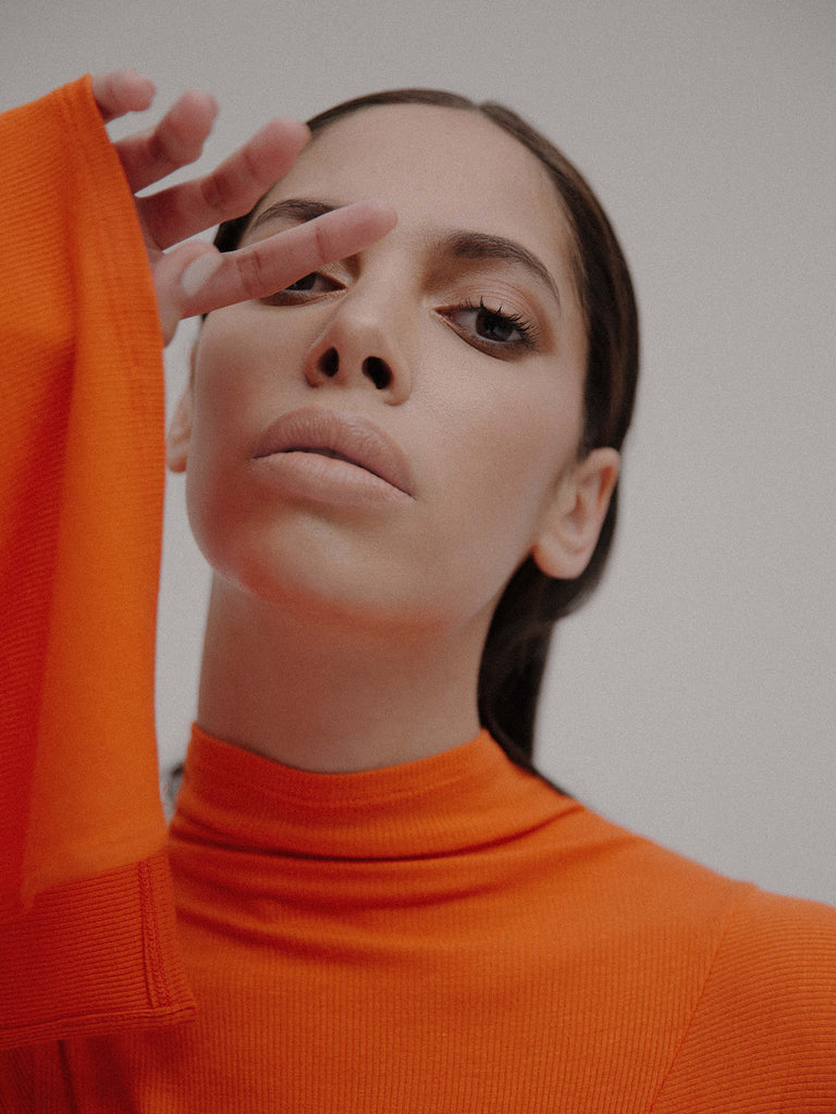 Woman in orange shirt