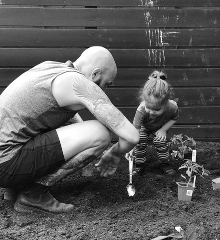 Rob Gentile gardening with his daughter