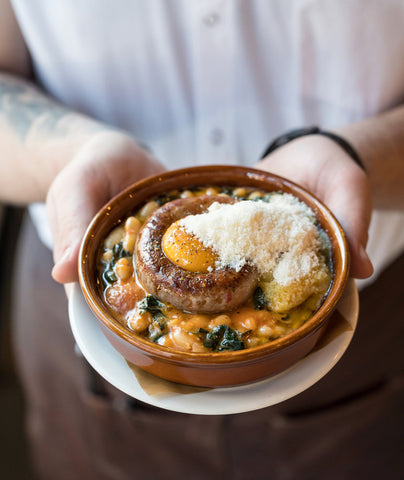 Rob Gentile holding a dish close up