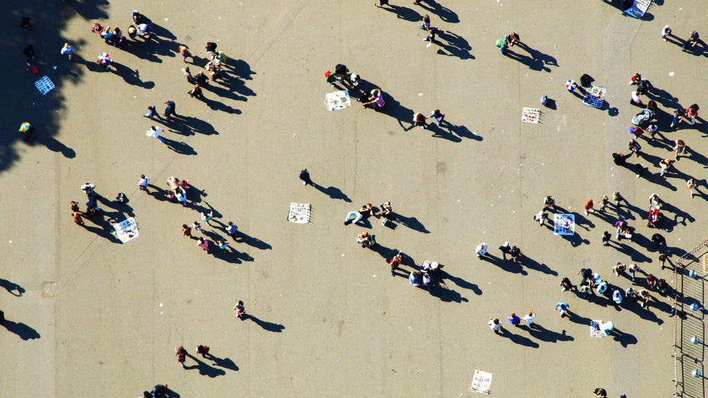 A photo taken from above of a courtyard filled with people. 