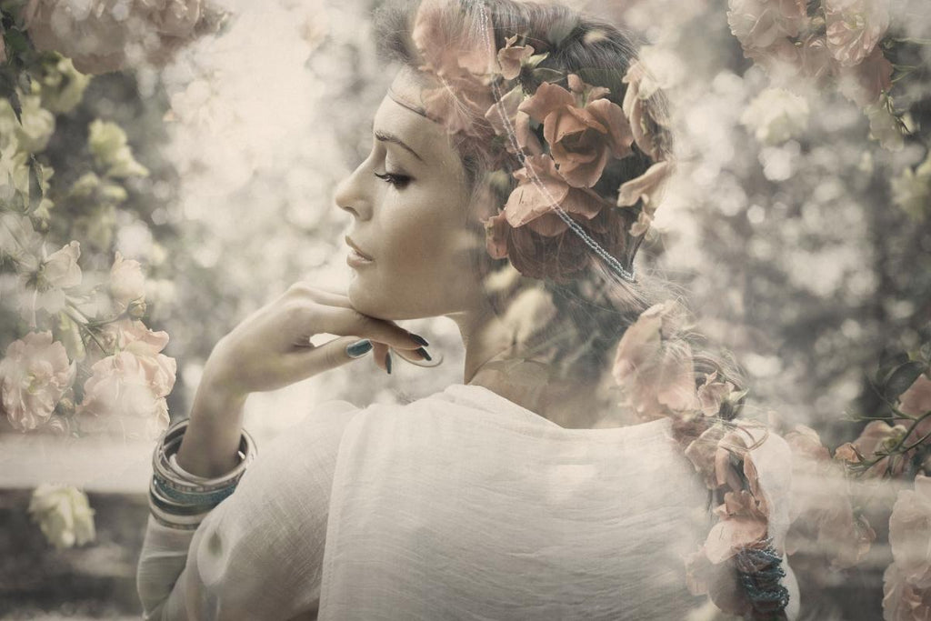Flowers and people: A woman double exposed with flowers