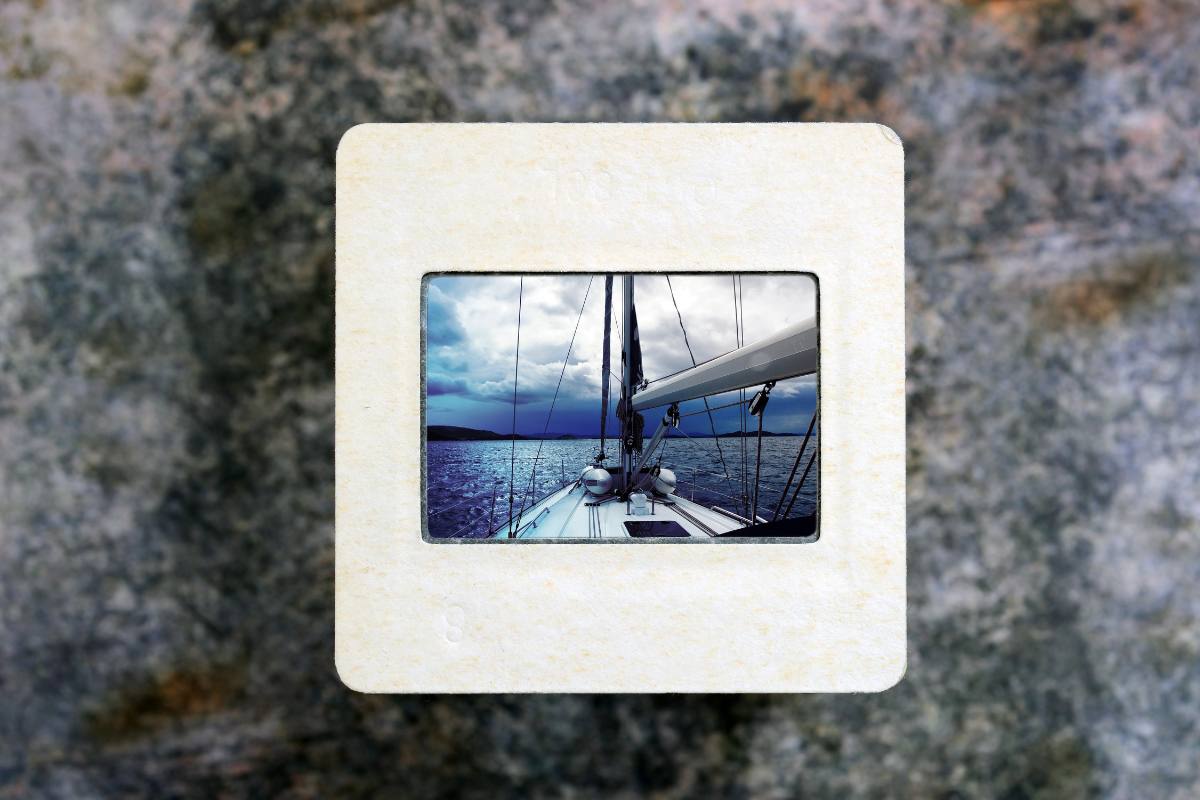 Slide film in frame with photo of a boat's nose.